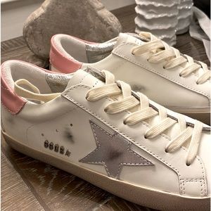 White leather sneakers with star